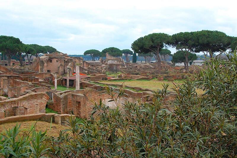 Panoramic photo with ruins, columns and pines