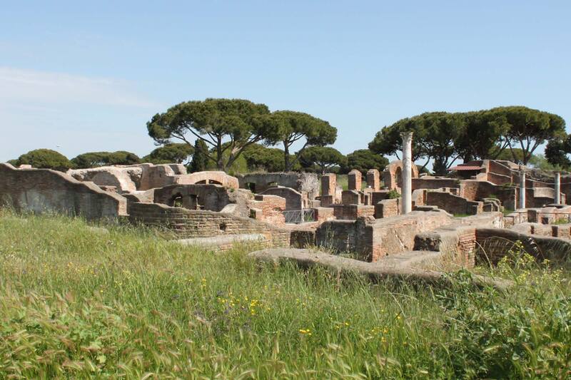 Panoramic photo with fields, ruins and columns