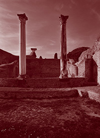 Floor of the hot room of the Baths of the Forum with two columns in the background, 2nd-5th century